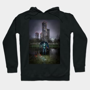 Man with Phone in Urban Park with Skyscrapers Behind Hoodie